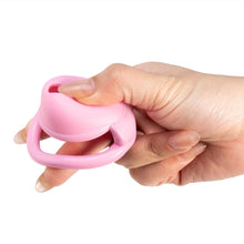 Lade das Bild in den Galerie-Viewer, Pink silicone dome chastity cage shown in hand
