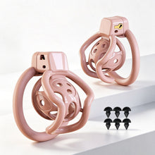 Lade das Bild in den Galerie-Viewer, Pink spider-frame plastic chastity cage shown from front and side with removable silicone studs
